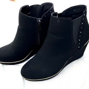 Black suede ankle boots with gold trim